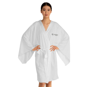 The Lux Glow Kimono Robe is designed for comfort and style, perfect for lounging at home, spa days, or poolside cover-ups. The lightweight, flowing fabric flatters various body types with a relaxed fit that drapes beautifully. The mid-length design provides ample coverage while allowing easy movement.